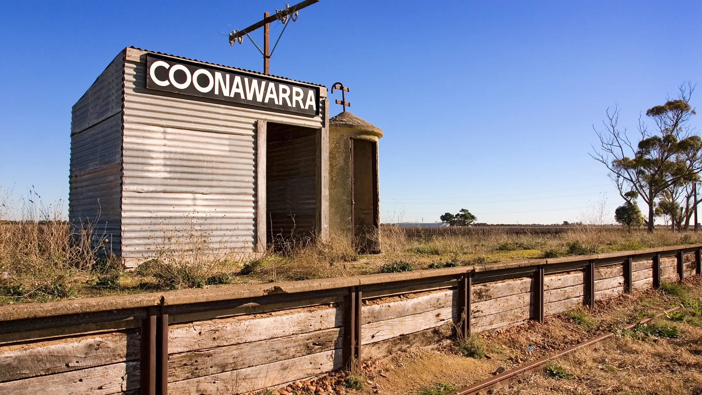 Shack with Coonawarra sign on the side in Australian desert